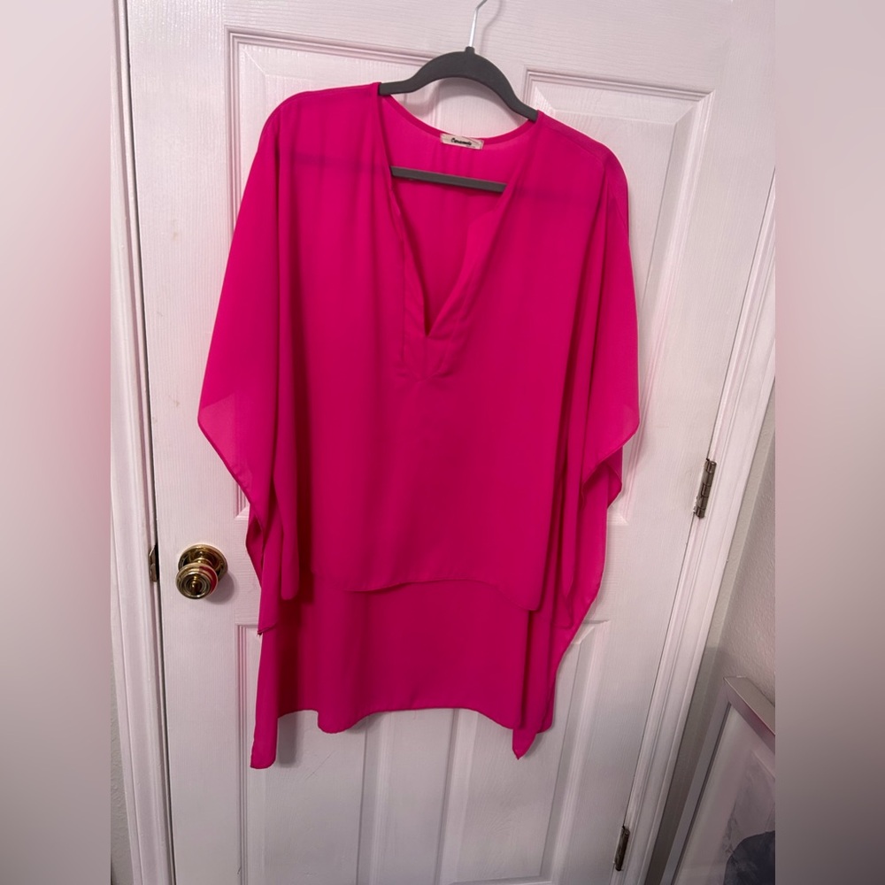 Women’s hot pink high low batwing blouse. Size large.